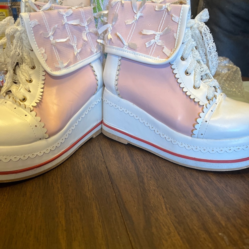 Pink platform boots with lacy shoe lace